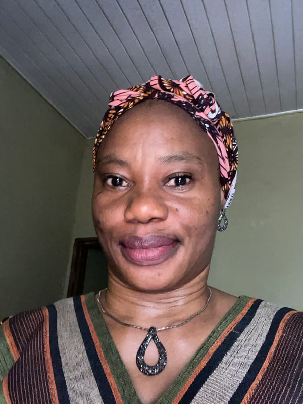 Woman photographed wearing patterned headscarf in Narayi, Nigeria