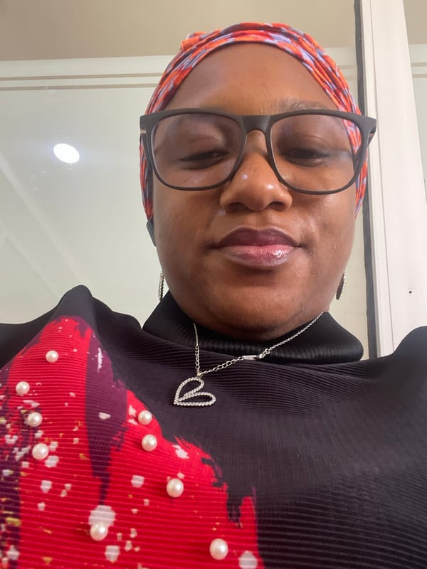 Woman in colorful headscarf photographed in Jos, Nigeria