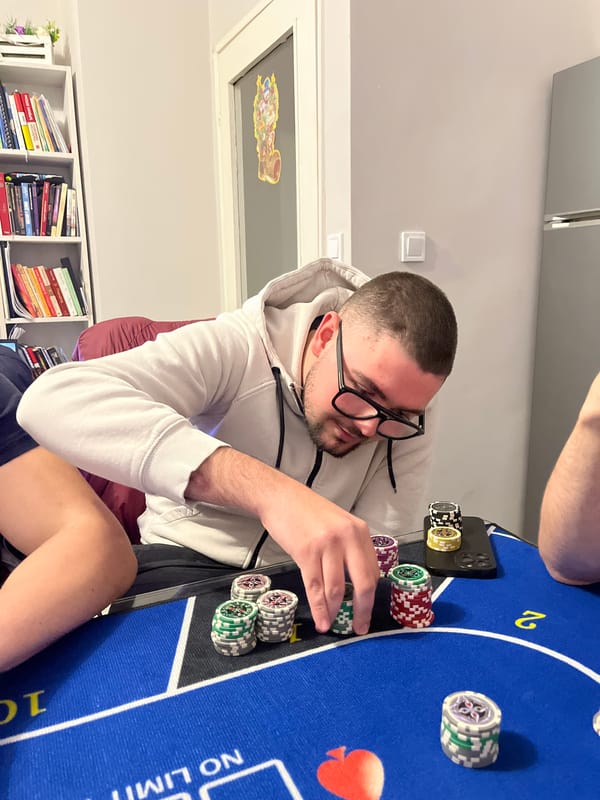 Man plays poker, stacks chips at Burgas table