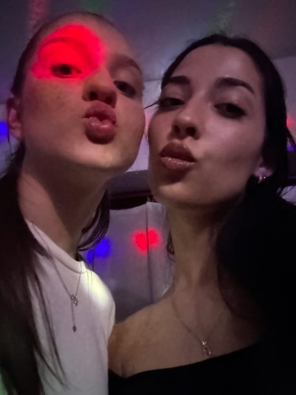 Two women pose for playful photo in Yablanitsa