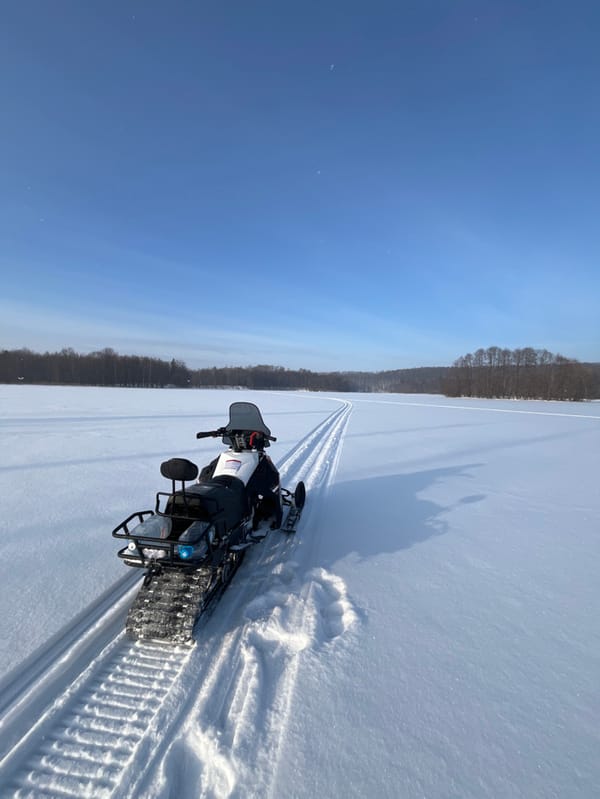 Winter selfie taken near snowmobile in snowy Vasilyevo, Russia