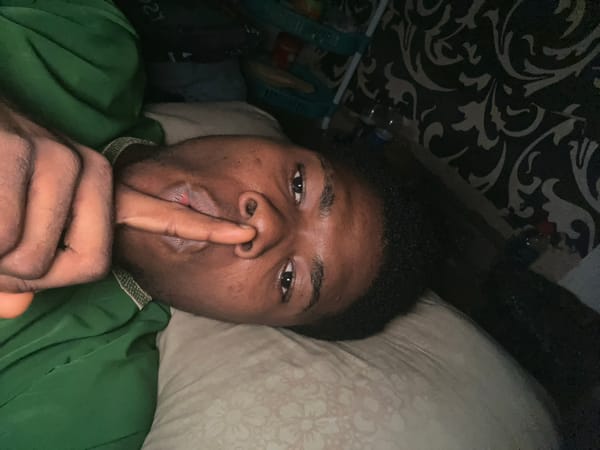 Late-night bedroom scene in Ihiagwa, lighter in hand