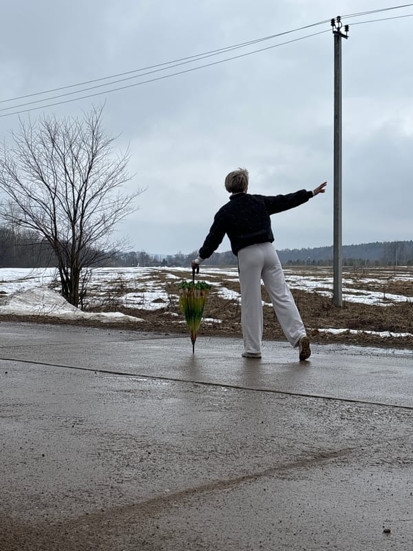 Woman performs yoga pose on street in Noviy, Russia
