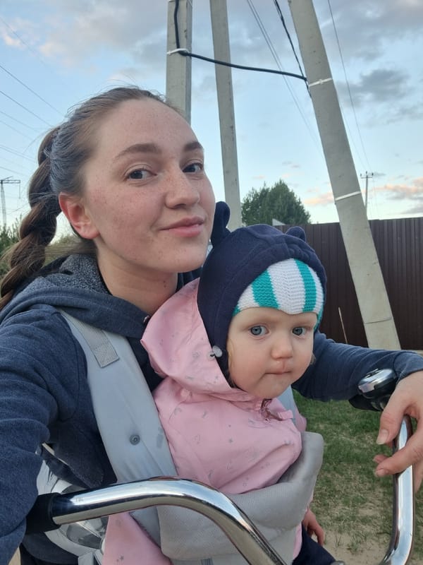 Woman with baby observed in urban area during twilight