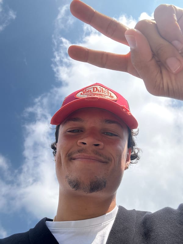 Young man documents warning signs during outdoor walk in France