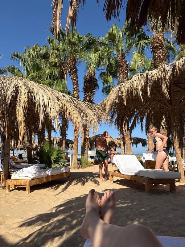 Afternoon on the Hurghada waterfront — beach, boats, and calm sea