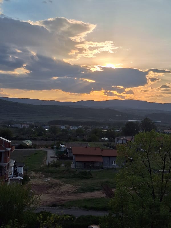 Dramatic sunset illuminates cloudy sky over Blagoevgrad valley