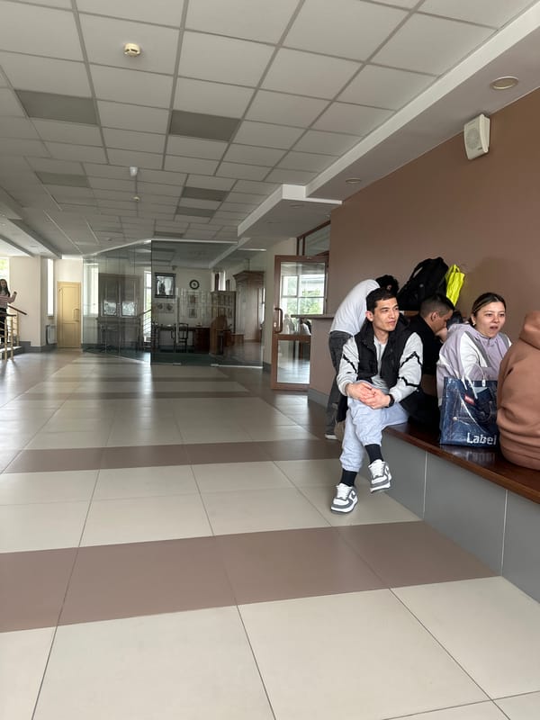 Young people rest in Kazan institutional hallway