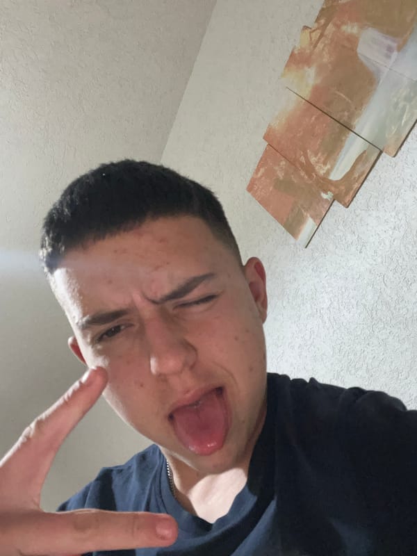 Young man takes playful selfies in Zlatograd bedroom