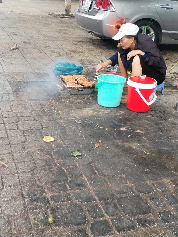Street food vendor operates stall in Nha Trang