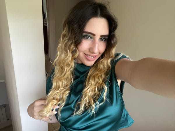 Woman takes selfie in green outfit in Bankya, Bulgaria