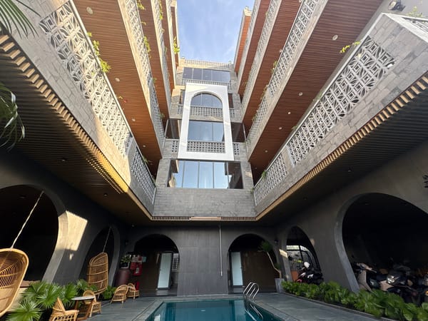Digital nomad works poolside at Da Nang complex