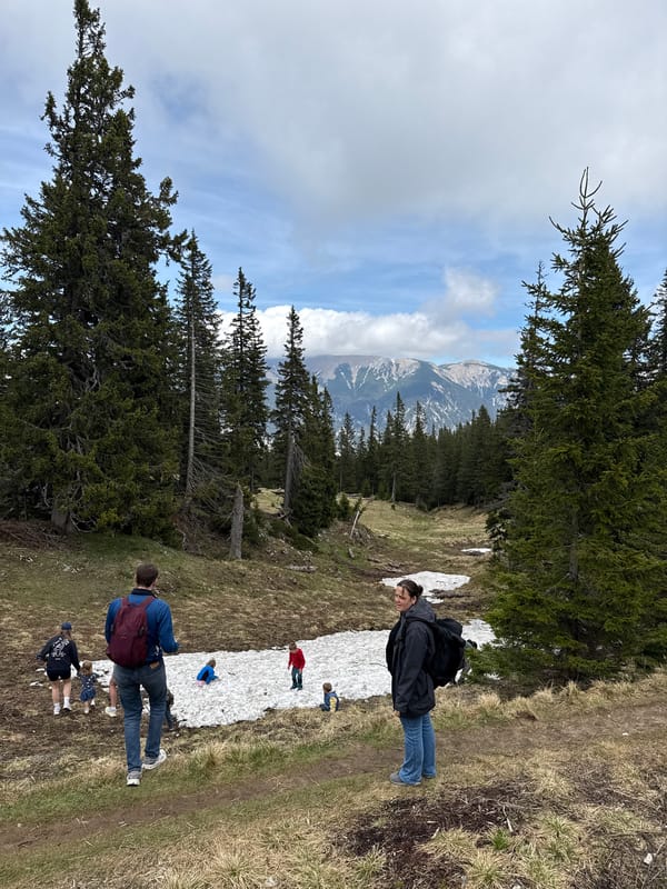 Hikers traverse snowy Alpine trail in Austrian mountains