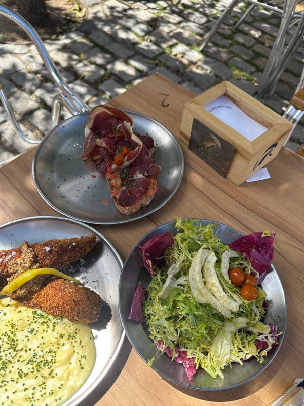 Lunch documented at Madrid restaurant with mixed salads, bread