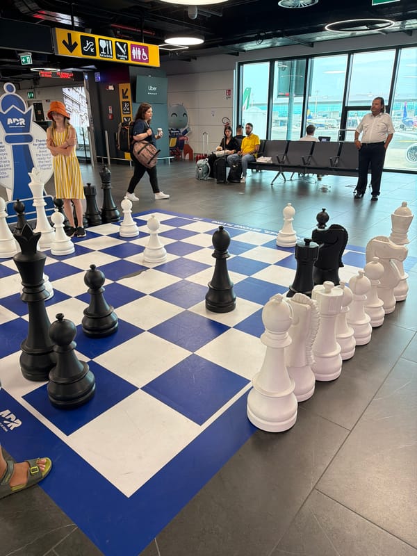 Killing time at Fiumicino with chess sets and tarmac views