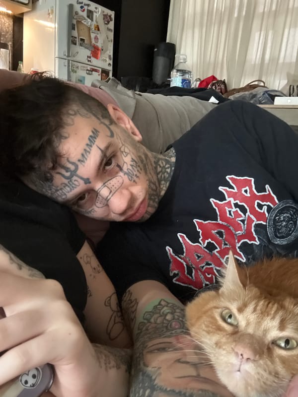 Man and orange cat share quiet domestic moment in Buenos Aires
