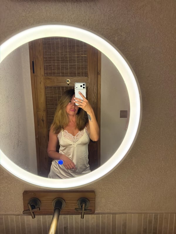 Woman takes bathroom mirror selfies in Mengwi, Indonesia