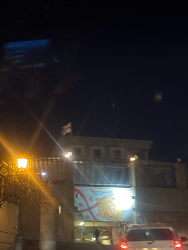 Illuminated religious and decorative displays spotted on Tbilisi buildings