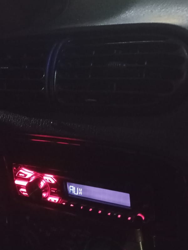 Evening drive through Krasnodar's commercial district captured on dashboard