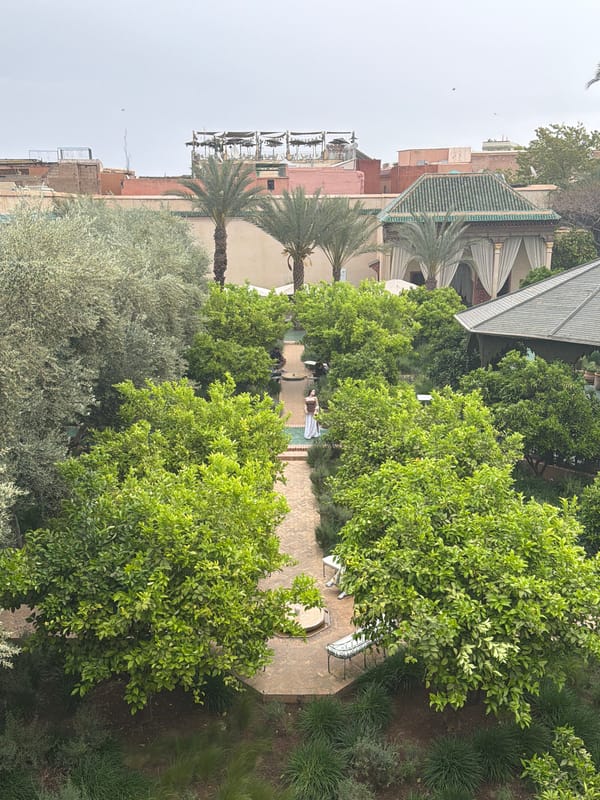 Visitor captures garden views and tile details at Marrakesh attraction