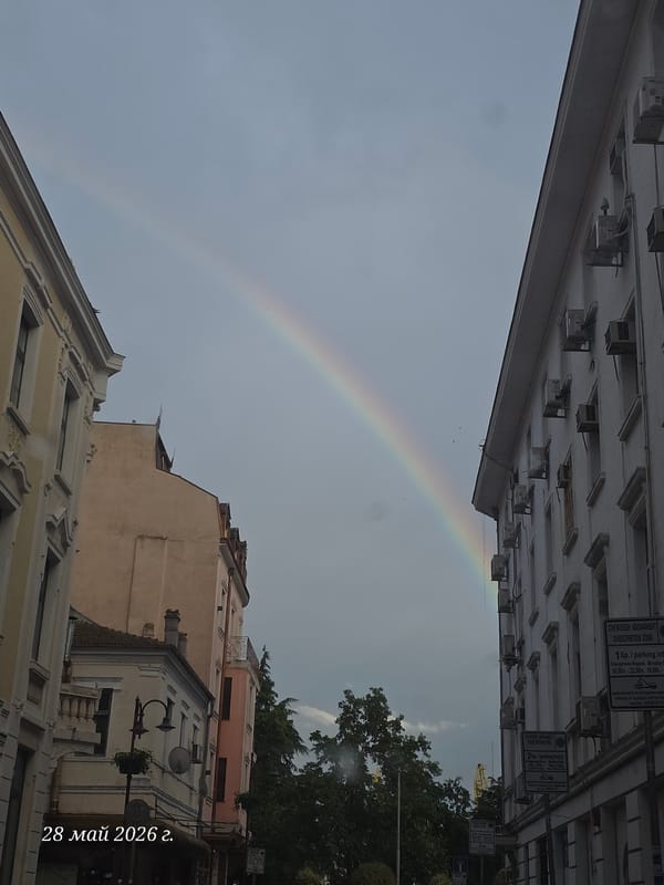 Rainbow appears over Burgas street scene in Bulgaria