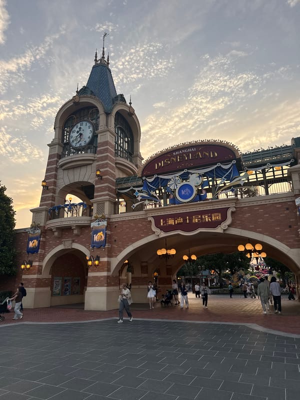 Shanghai Disneyland entrance photographed under cloudy skies