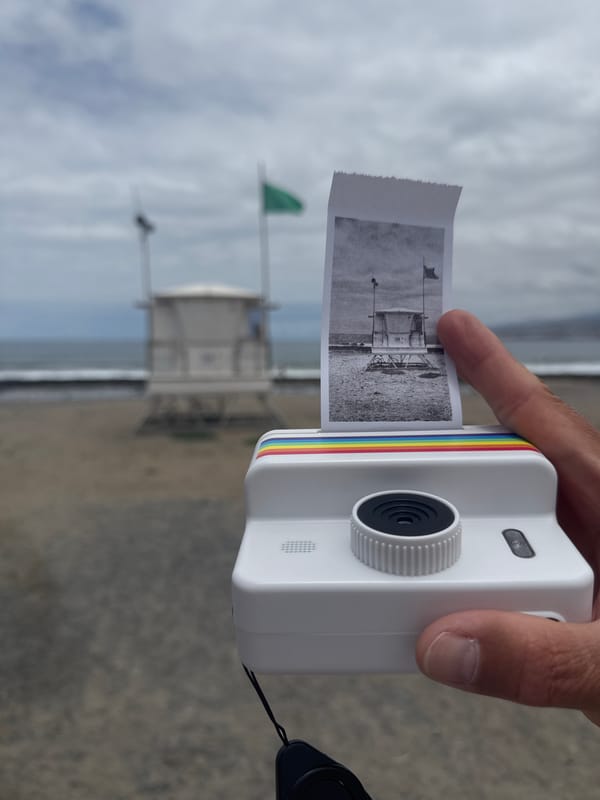Cameras out on a Tenerife beach, Polaroid and digital