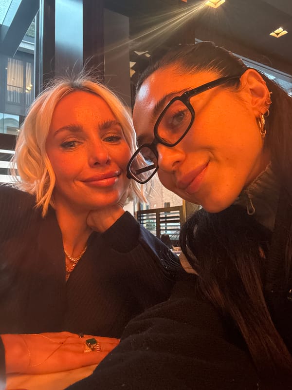 Two women take selfies at London restaurant