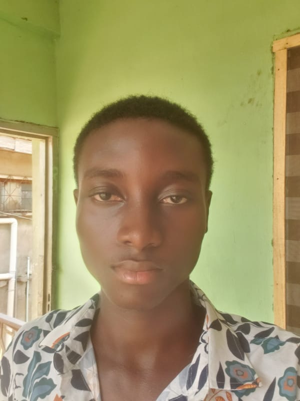 Young man documents casual gathering in Nigerian neighborhood