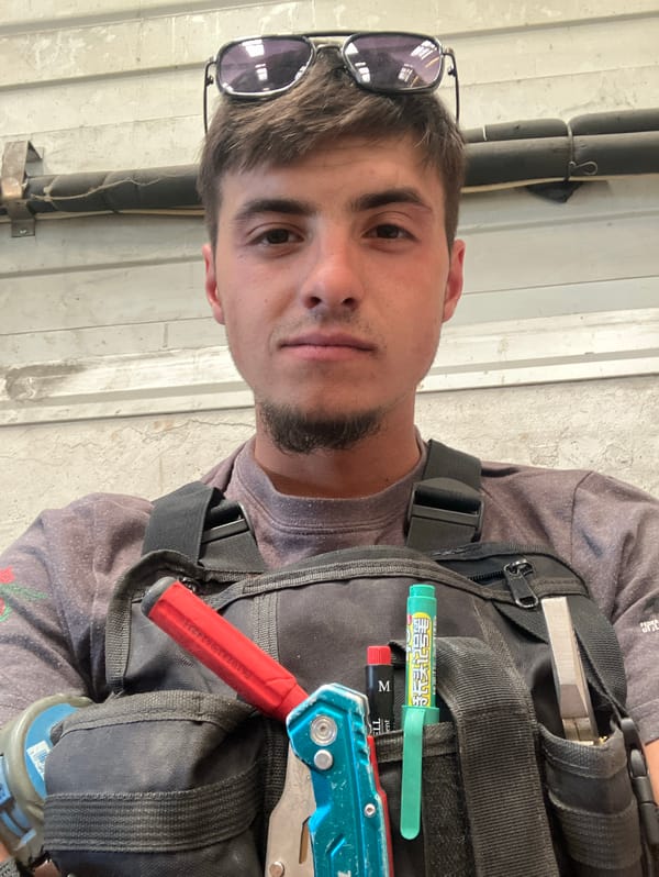 Construction worker documents industrial tank project in Haskovo, Bulgaria