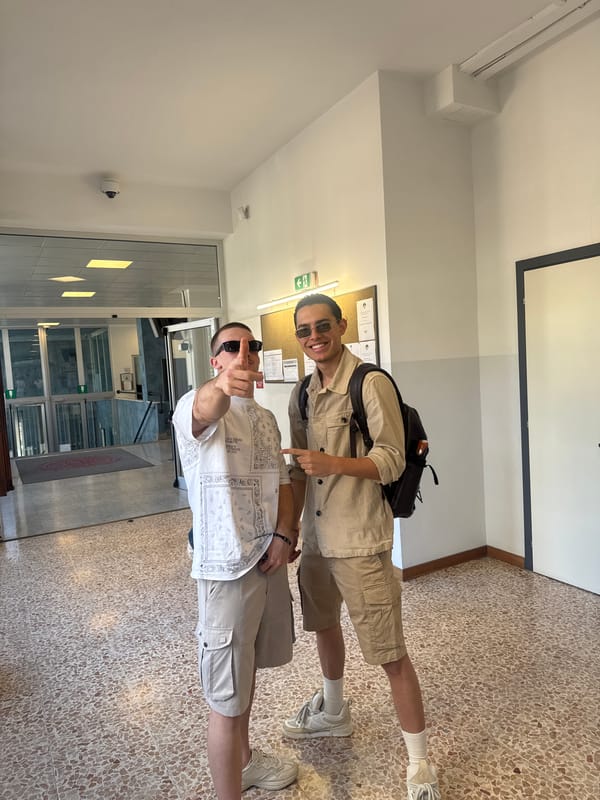 Young people photographed in Milan building hallway