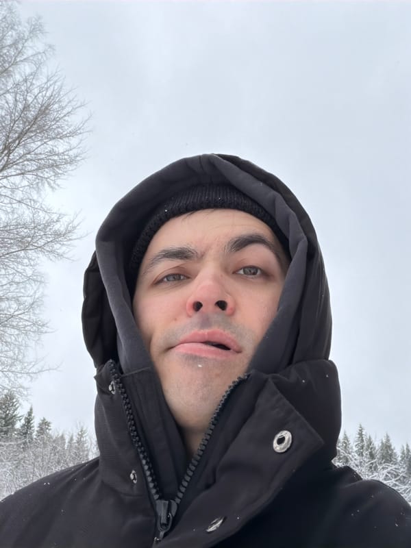 Dachshund walks through snowy parking area in Izhevsk