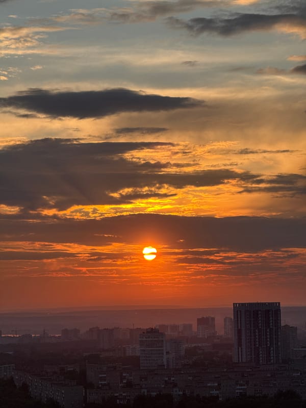 Sunset breaks through dramatic clouds over rural Russia