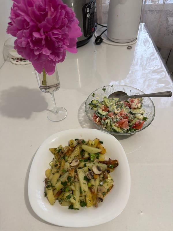 Woman enjoys home-cooked meal in Russian kitchen
