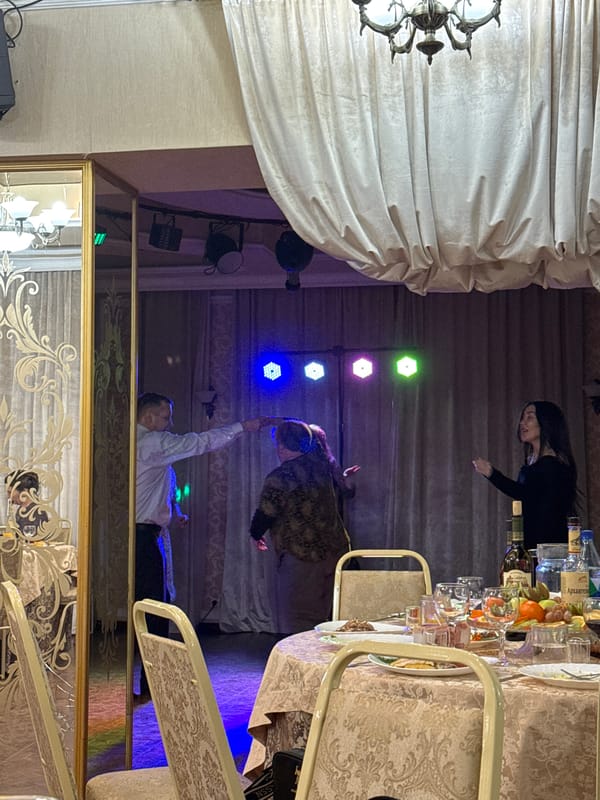 Banquet table with food, drinks documented in Chernushka, Russia