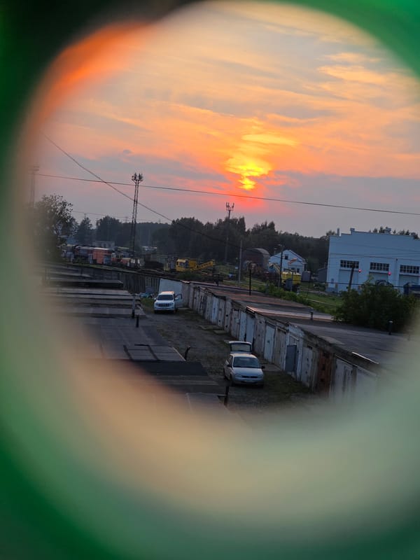 Sunset over Chaikovsky, lilies and a clock in the glow