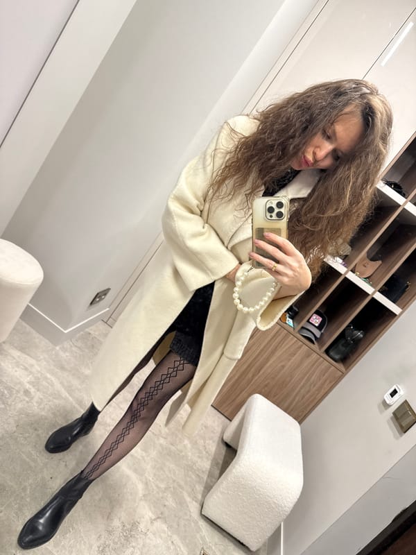 Woman takes selfie in closet in Khimki, Russia