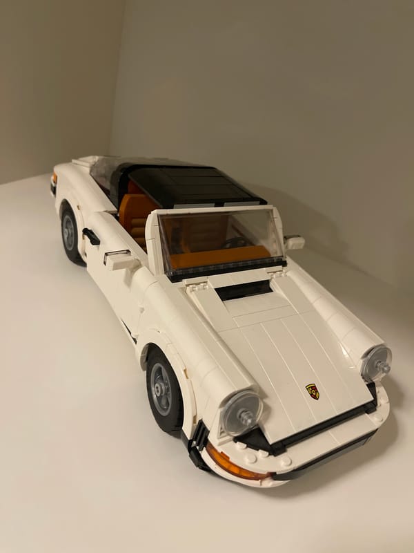LEGO car collection displayed in Russian home