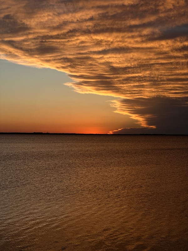 Sunset observed over calm waters in Kokshetau, Kazakhstan
