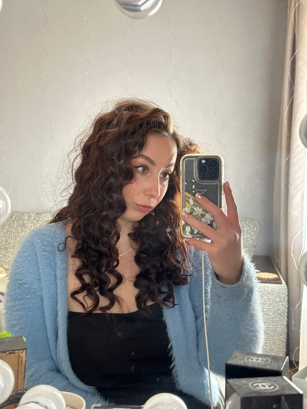 Woman takes morning selfies in Liepaja, Latvia