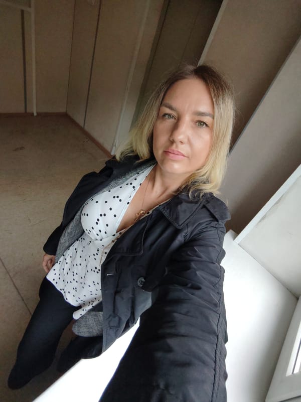 Woman documents evening drive through rainy Petropavlovsk-Kamchatsky