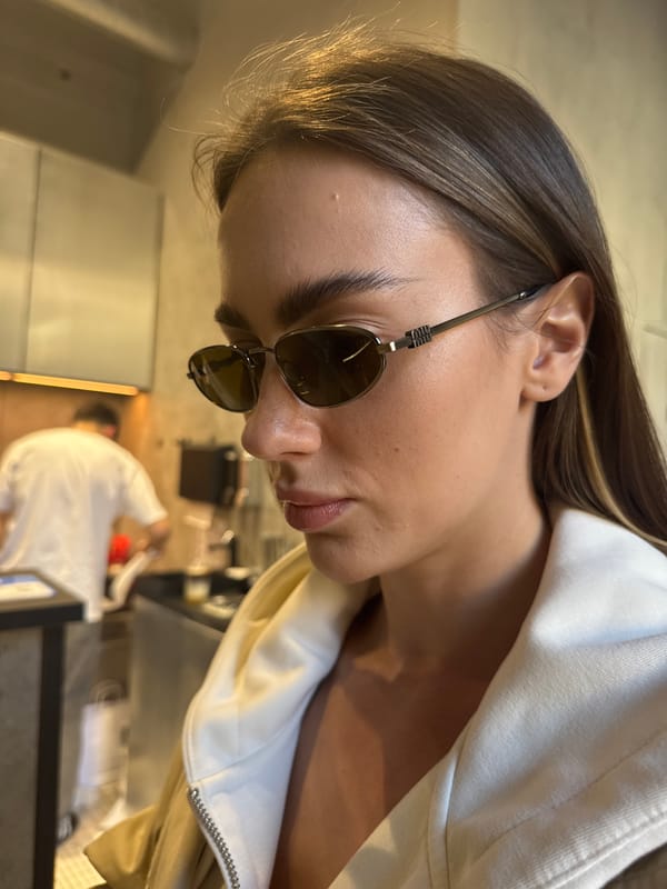 Woman documents afternoon visit to Warsaw café and shops