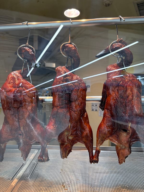 Roasted ducks displayed in glass case, Baan Bo Phut