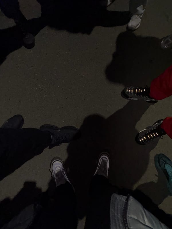 Nighttime street gathering captured by overhead witness documentation