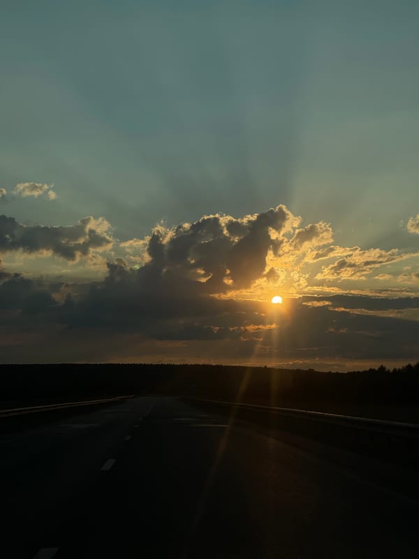 Sunset rays over a Russian highway in Niva