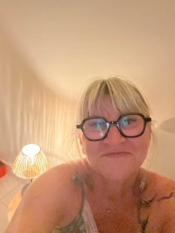 Casual selfie moment in a Cannes interior, evening