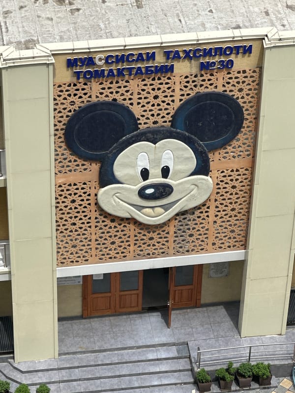 Dushanbe cityscape features Mickey Mouse building decoration