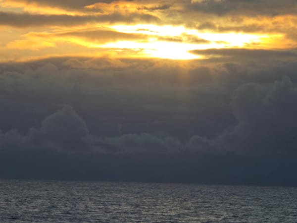 Twilight seascape captured with changing clouds and rippling waters