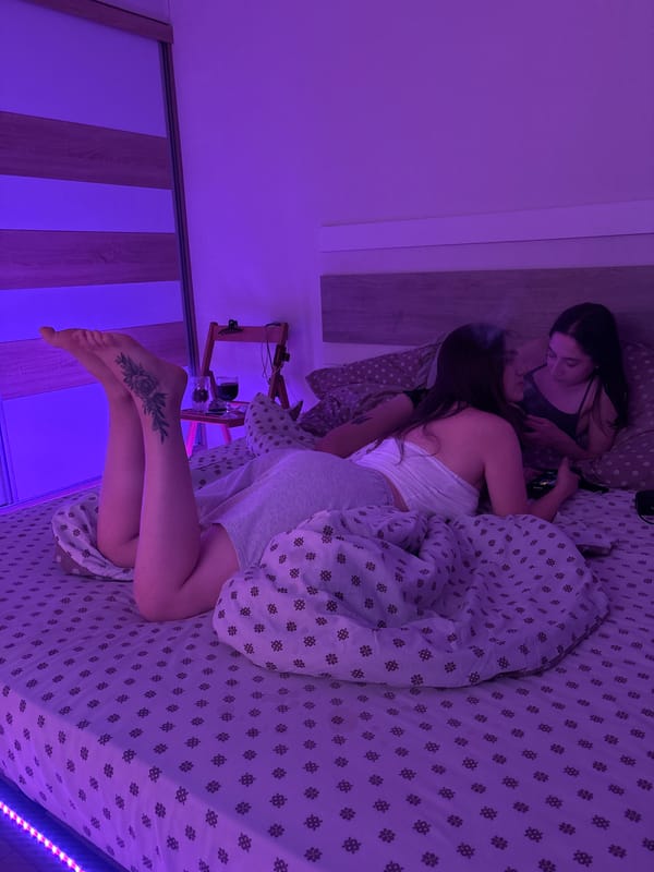 Late-night hangout in a dimly lit bedroom with purple ambiance