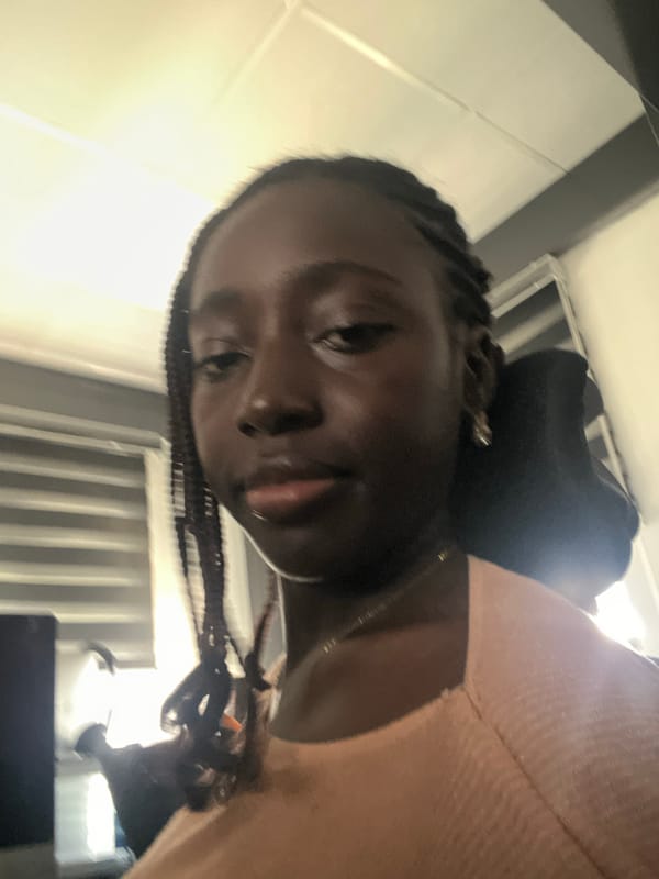 Woman takes multiple selfies in Karum, Nigeria